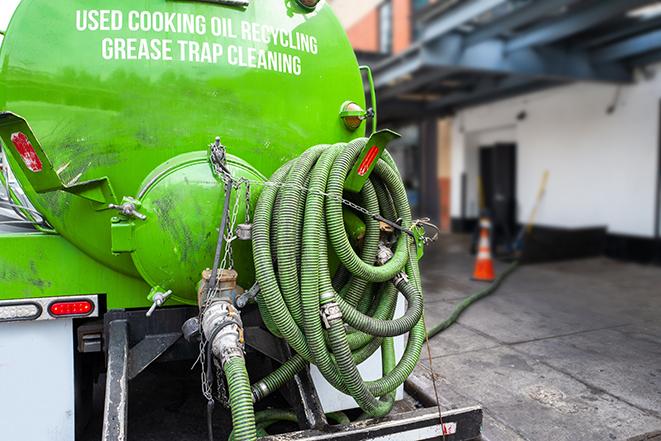 a grease trap pumping truck at a restaurant in Beach Haven West, NJ